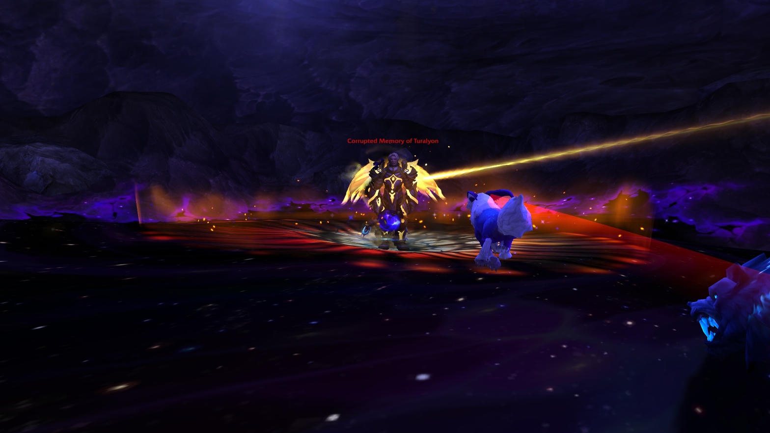 A wide cavern shot. A small armored figure with gold wings stands in a red pool. The game’s own label above him reads Corrupted Memory of Turalyon.